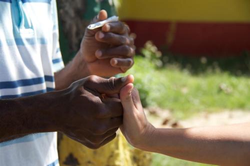 two people holding hands while holding each other at Da Fabio in Negril