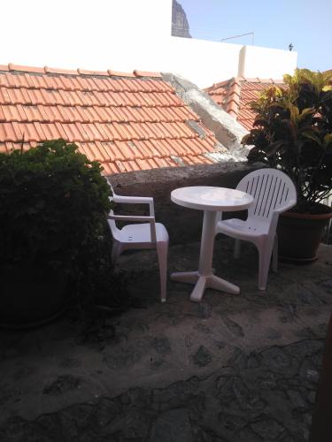 two chairs and a table and a table and chairs at Casa Cira in Calera