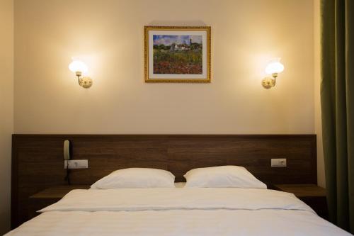 Кровать или кровати в номере Отель Проспект Мира