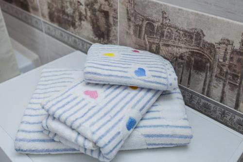 a couple of towels sitting on top of a table at Apartment on Lenina 69А in Tyumen