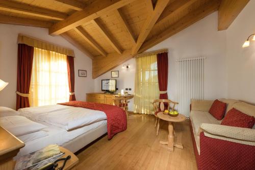 Postel nebo postele na pokoji v ubytování Romantic Charming Hotel Rancolin