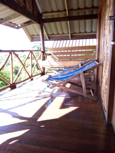 a porch with a hammock in a building at Tabeak View Point in Ko Yao Noi