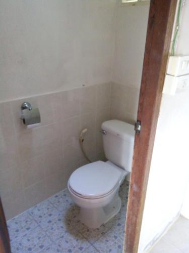 a bathroom with a white toilet in a room at Tabeak View Point in Ko Yao Noi
