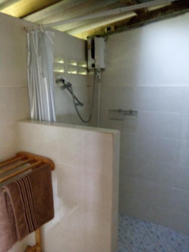 a bathroom with a shower with a shower curtain at Tabeak View Point in Ko Yao Noi