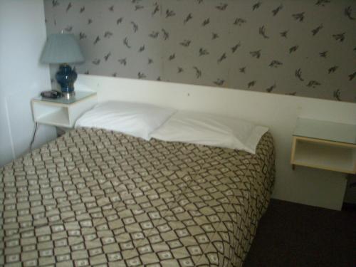 Postel nebo postele na pokoji v ubytování Motel le Verseau