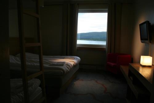 Postel nebo postele na pokoji v ubytování Tärnaby Fjällhotell