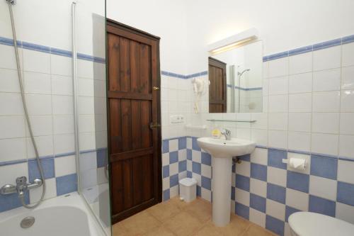 a bathroom with a sink and a toilet and a shower at Binibeca Beach Villas in Binibeca