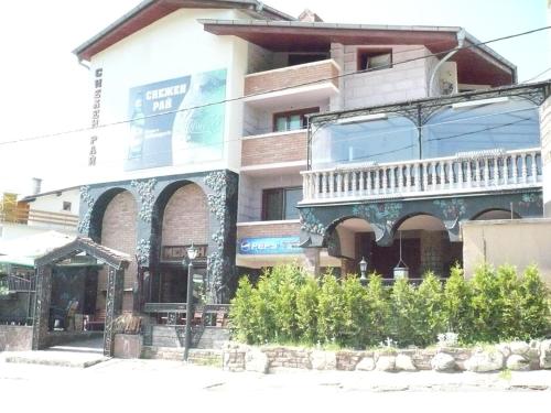 a building with a balcony on the side of it at Snow Heaven Hotel in Bankya