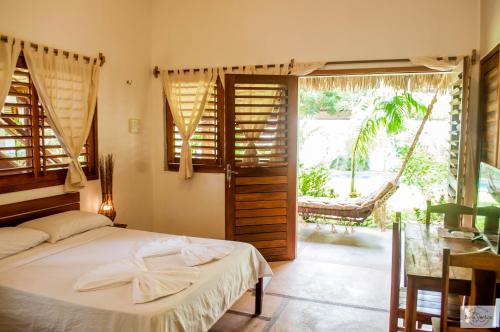 Cama ou camas em um quarto em Residence Bons Ventos Jeri