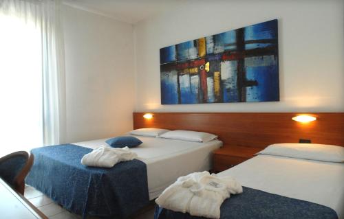 Postel nebo postele na pokoji v ubytování Hotel Scaldaferro