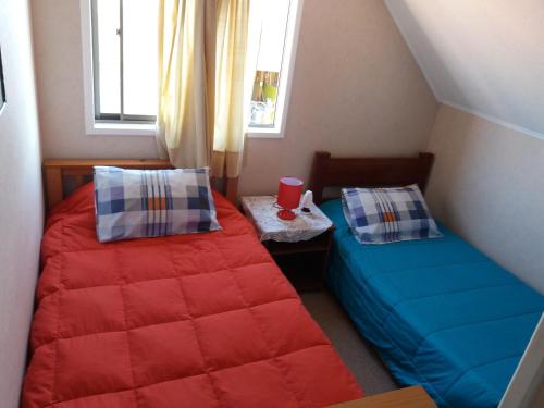 Un pat sau paturi într-o cameră la Casa de veraneo Peñaflor