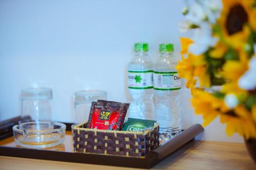a tray with bottles of water and snacks on a table at Royal Hotel Ha noi in Hanoi