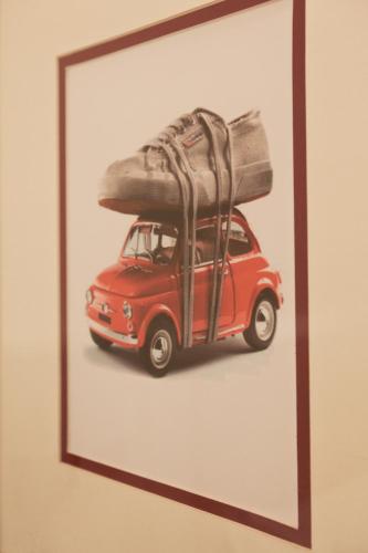 a picture of a red car with luggage on top at Hotel Italia in Siena