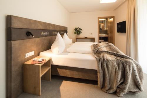 Кровать или кровати в номере enjoy ischgl