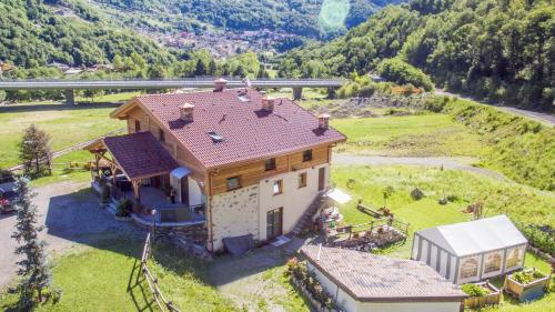 an aerial view of a house in a field at B&B Valtilí in Berzo