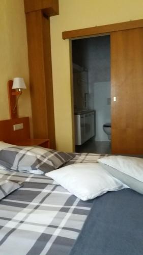 Postel nebo postele na pokoji v ubytování Hotel 'T Hert