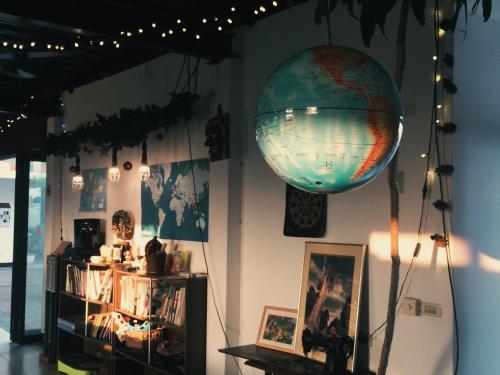 a room with a globe hanging on the wall at Puli Islet Inn in Puli