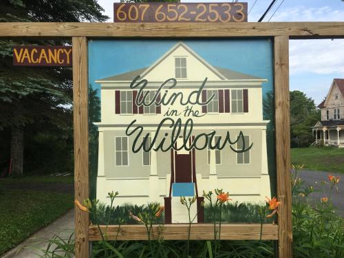 a sign for a house with the words waiting in the kitchen at Wind in the Willows Overnight in Jefferson