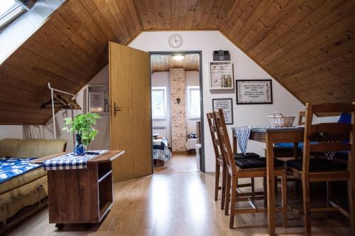 a room with a table and a dining room at Penzion u Lupíků in Frýdlant nad Ostravicí