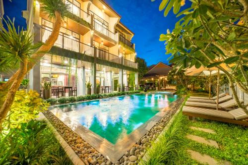an image of a swimming pool in front of a building at Dai An Phu Villa in Hoi An