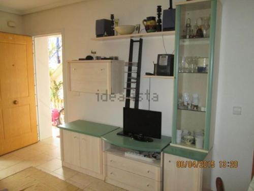 a room with a desk with a television on it at Residencial Veramar 4, Vera Playa, Almeria in Vera