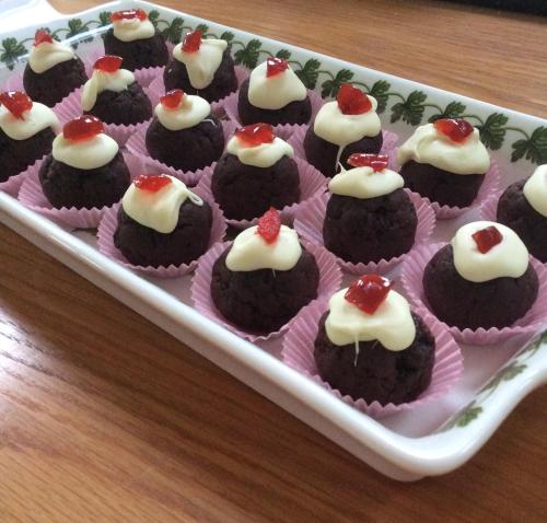 a tray of chocolate cupcakes with cream cheese and cherries at Luachra Lodge in Killarney