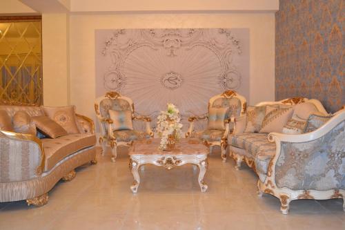 a living room with two couches and a coffee table at Hotel Elita in Odesa