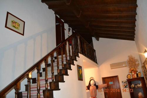 a staircase in a living room with wooden stairs at Casa da Maria in Monsanto