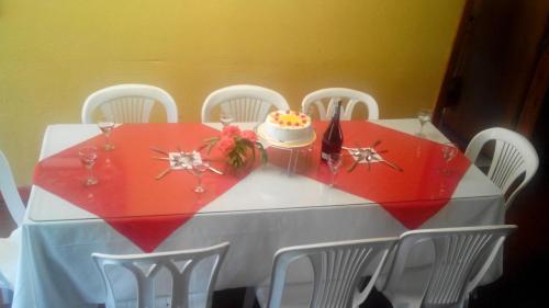 a table with a cake on top of it at Cabana hotel eco turistico el EDEN in Güicán