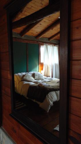 Ένα ή περισσότερα κρεβάτια σε δωμάτιο στο Criollo Lodge