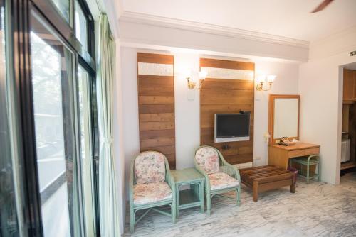 Hu Shan Hot Spring Hotelにあるテレビまたはエンターテインメントセンター