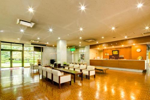 a lobby with a cafeteria with a table and chairs at Yamagata-City AKOYA in Yamagata