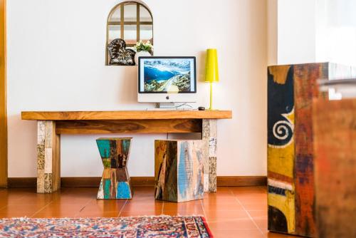 a room with a desk with a computer on it at Sporthotel Villa Stella in Nago-Torbole