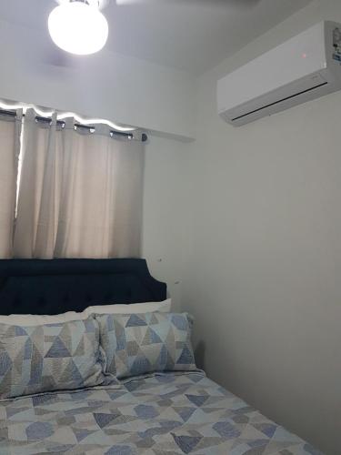 Ένα ή περισσότερα κρεβάτια σε δωμάτιο στο KSL Residence