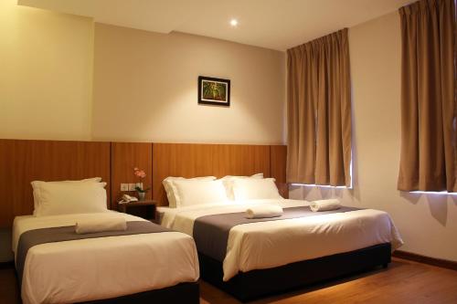 Postel nebo postele na pokoji v ubytování Ahyu Hotel