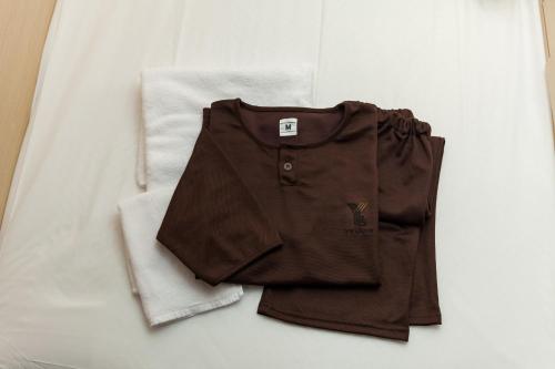 a pair of shorts and a white towel at Y's HOTEL Hanshin Amagasaki Ekimae in Amagasaki