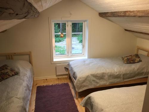 Postel nebo postele na pokoji v ubytování Hyttsnåret
