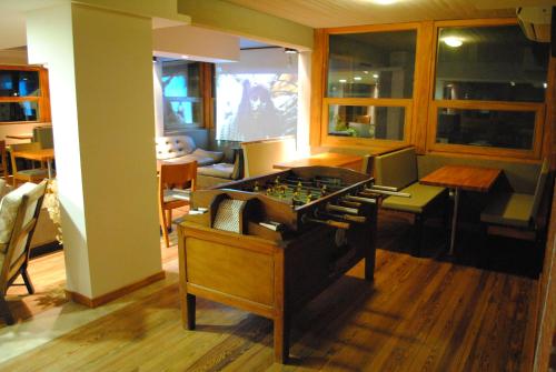 a living room with a foosball table in it at Complejo Sakura in Villa Gesell