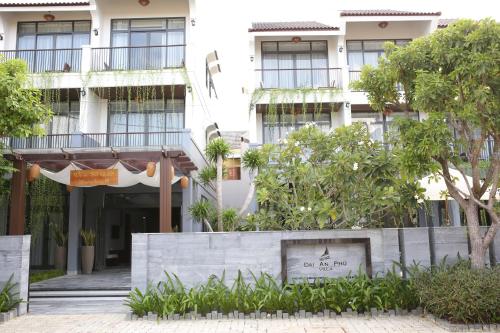 a building with a sign in front of it at Dai An Phu Villa in Hoi An