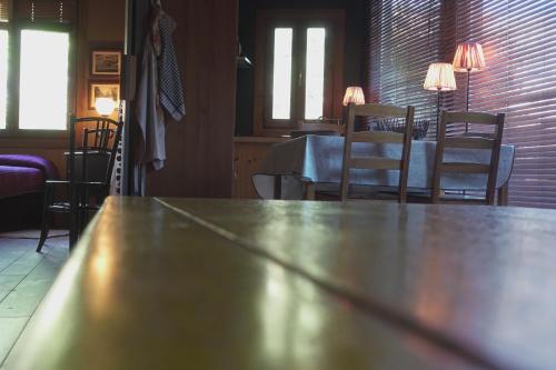 a table in a room with a table and chairs at Las Horas Perdidas in Manzanares el Real