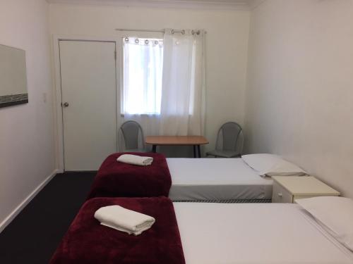 Postel nebo postele na pokoji v ubytování Restawile Motel