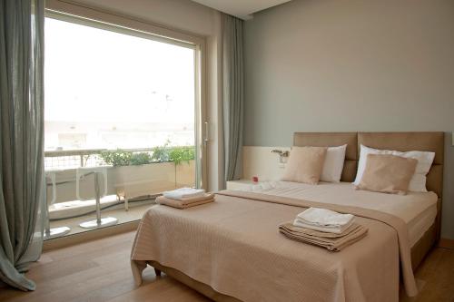 Postel nebo postele na pokoji v ubytování Unique Acropolis View