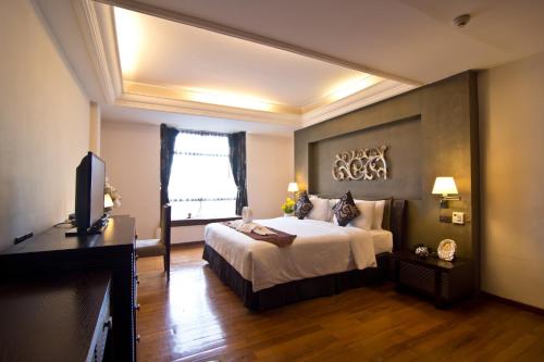 Кровать или кровати в номере LK Mantra Pura Resort