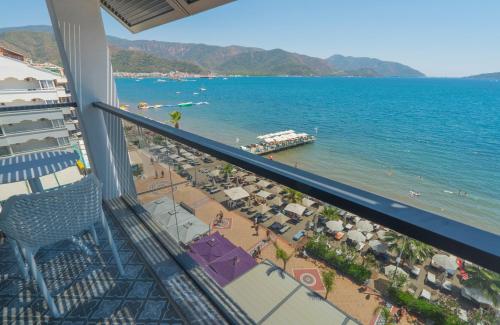 a view of the beach from the balcony of a resort at Marmaris Beach Hotel in Marmaris