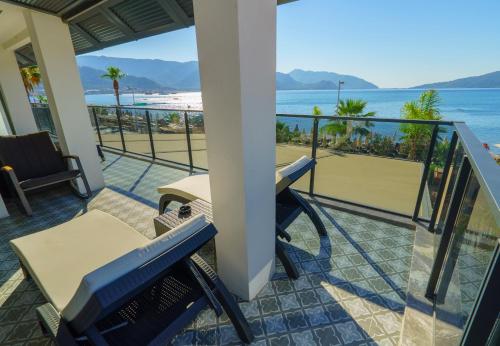 a balcony with a view of the beach at Marmaris Beach Hotel in Marmaris