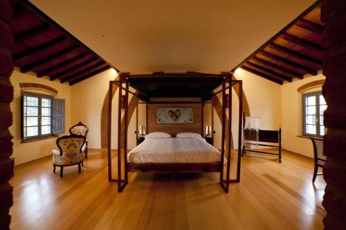 En eller flere senge i et værelse på Agriturismo Cascina Farisengo