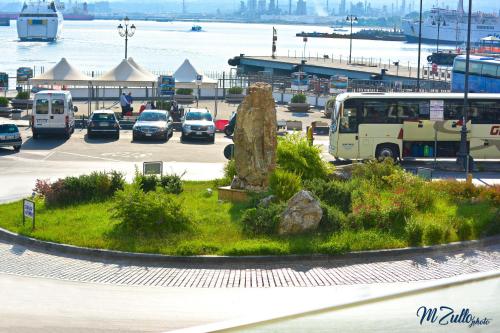 a parking lot with cars parked in a parking lot at B&B Rakel Home in Milazzo