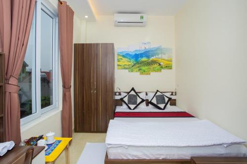 Un ou plusieurs lits dans un hébergement de l'établissement Friendly Home Hotel