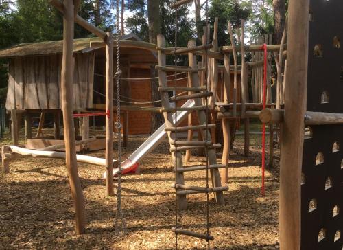 a playground with a slide in a park at Ferienhaus Daul in Wandlitz