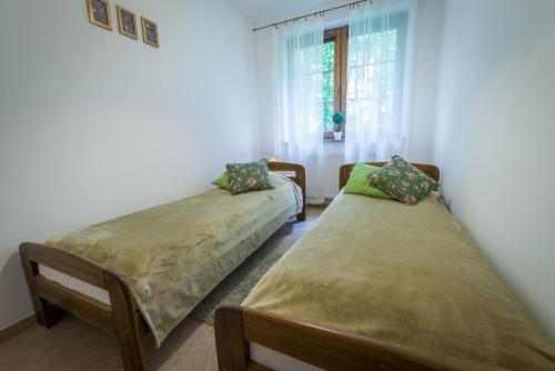 Postel nebo postele na pokoji v ubytování Orzechowy